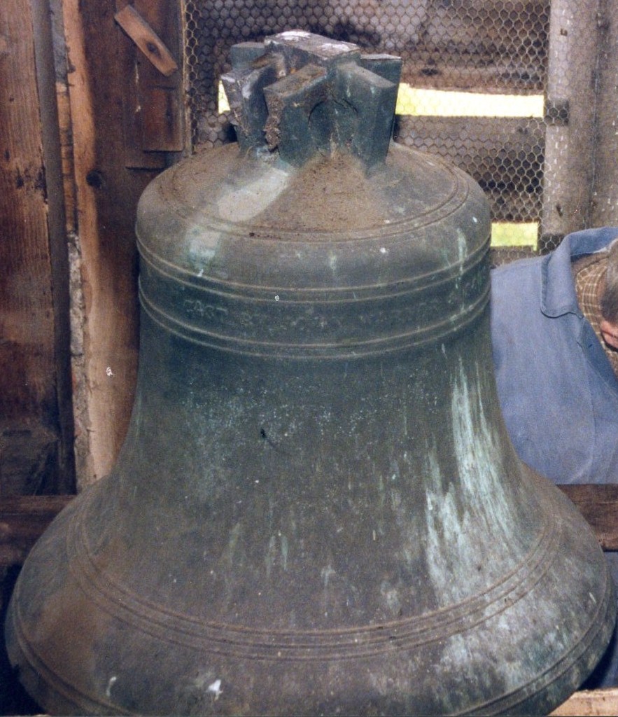 Bell at St Peter's showing old cast-in staples before removal